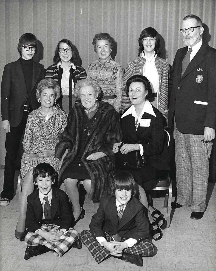 Rabe Family c1972 at Detroit Press Club. Standing: brother Karl Rabe, cousin Jane Mountain, Juanita Mountain, sister Joan Rabe, father WT Rabe; seated: Aunt Jane Mountain, Grandma Clara Rady, mother Ann Rabe. front, brother James Rabe, and John Rabe.